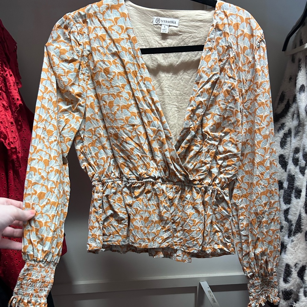 Long sleeve Versona blouse. Perfect for date nights in the fall.